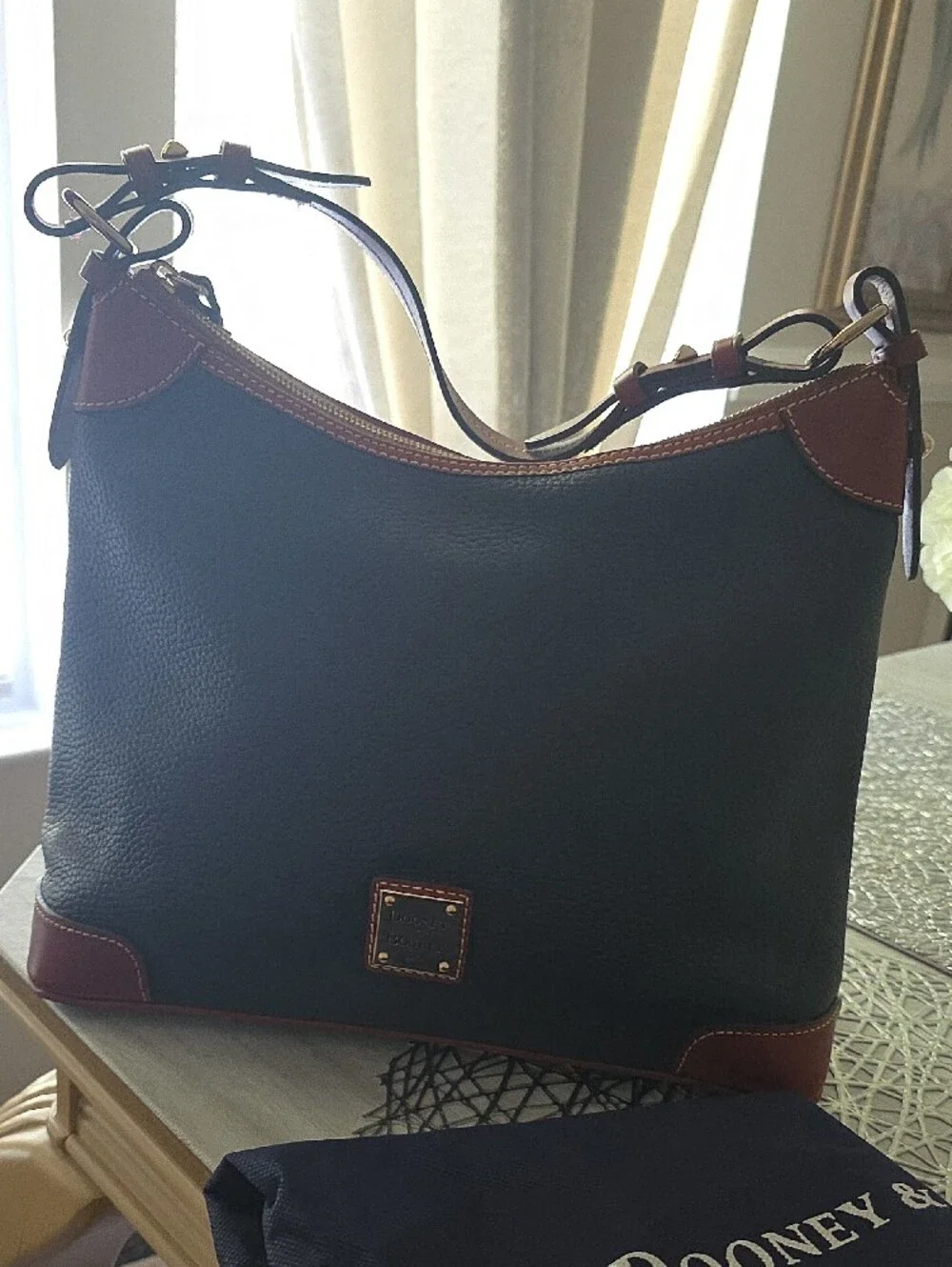 Dooney & Bourke Black Pebble Leather Messenger Bag with Brown Trim